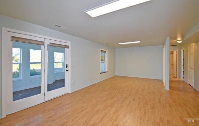 spare room with light wood-type flooring