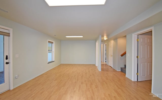 spare room with light hardwood / wood-style flooring