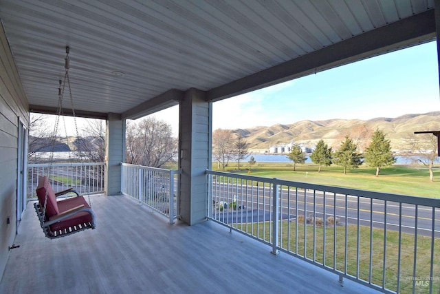 wooden terrace with a mountain view