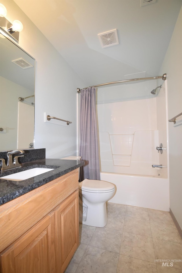 full bathroom with vanity, toilet, shower / tub combo, and tile patterned flooring