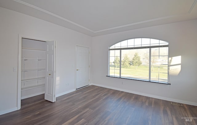 unfurnished room featuring dark hardwood / wood-style floors