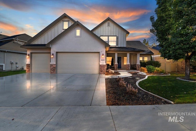 view of front of house with a yard and a garage