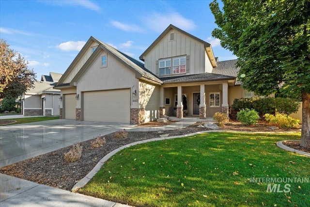 craftsman inspired home with a garage, covered porch, and a front yard