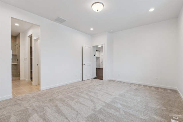 unfurnished bedroom with recessed lighting, visible vents, carpet floors, and baseboards