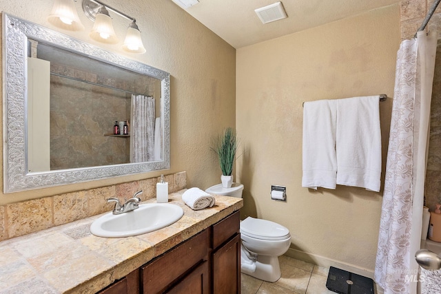 bathroom featuring toilet, walk in shower, vanity, and tile patterned floors