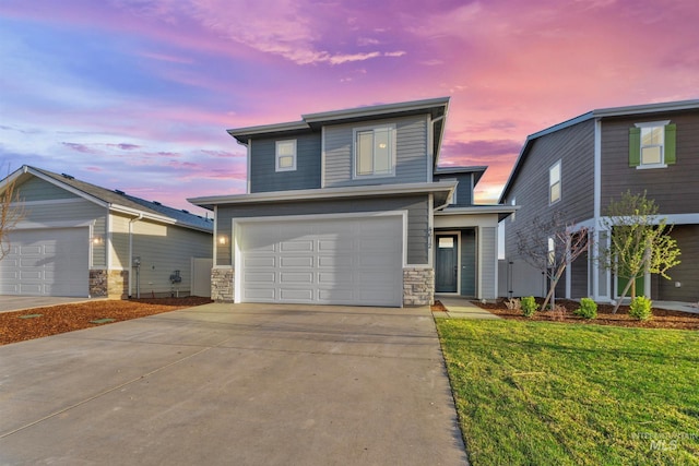 690 N Tessa Ave, Meridian, ID 83642 - view of front facade featuring stone siding, driveway, a yard, and a garage