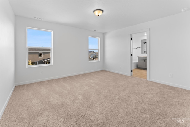690 N Tessa Ave, Meridian, ID 83642 - unfurnished bedroom with carpet flooring, baseboards, and ensuite bath