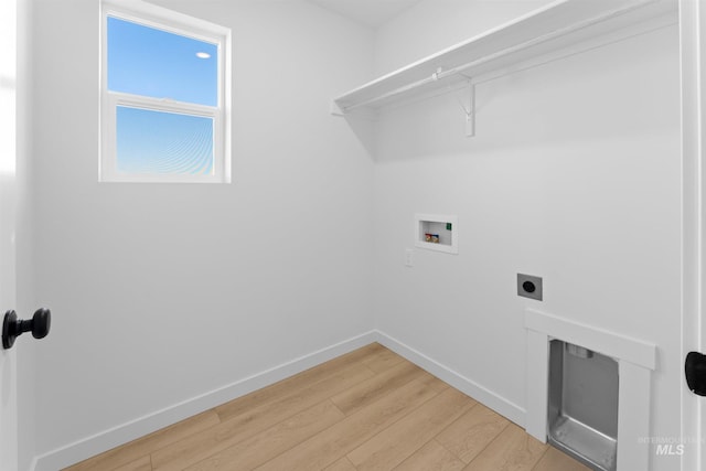690 N Tessa Ave, Meridian, ID 83642 - laundry room featuring washer hookup, electric dryer hookup, light wood-type flooring, and baseboards