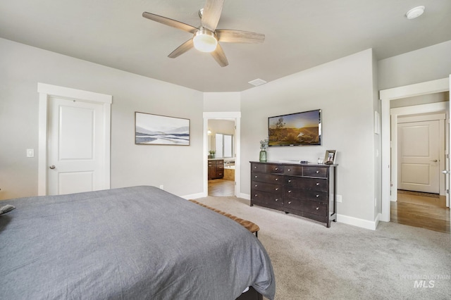 2858 Sunray Loop, Twin Falls, ID 83301 - carpeted bedroom with baseboards, a ceiling fan, and ensuite bathroom