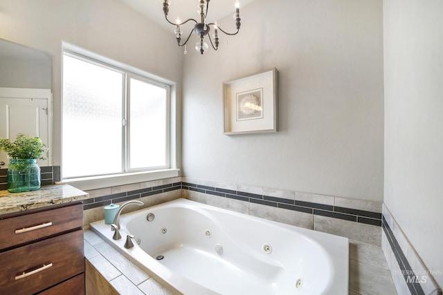 2858 Sunray Loop, Twin Falls, ID 83301 - full bath featuring a tub with jets, a chandelier, and vanity