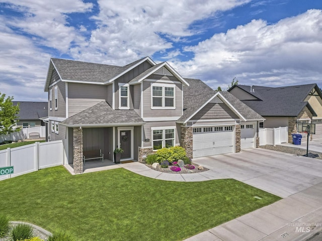 2858 Sunray Loop, Twin Falls, ID 83301 - craftsman-style house with stone siding, concrete driveway, a garage, a shingled roof, and board and batten siding