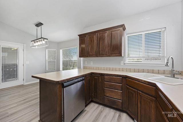 1030 Caswell Ave W, Twin Falls, ID 83301 - kitchen featuring stainless steel dishwasher, light wood-type flooring, a peninsula, and light countertops