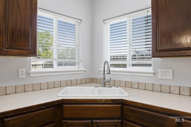 1030 Caswell Ave W, Twin Falls, ID 83301 - kitchen featuring dark brown cabinets and light countertops