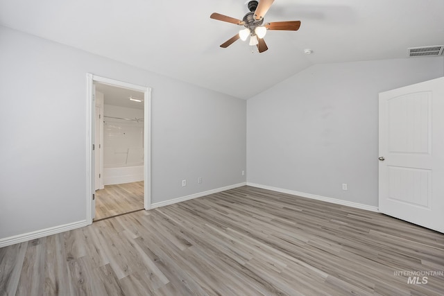1030 Caswell Ave W, Twin Falls, ID 83301 - unfurnished bedroom featuring vaulted ceiling, wood finished floors, ensuite bathroom, and a ceiling fan