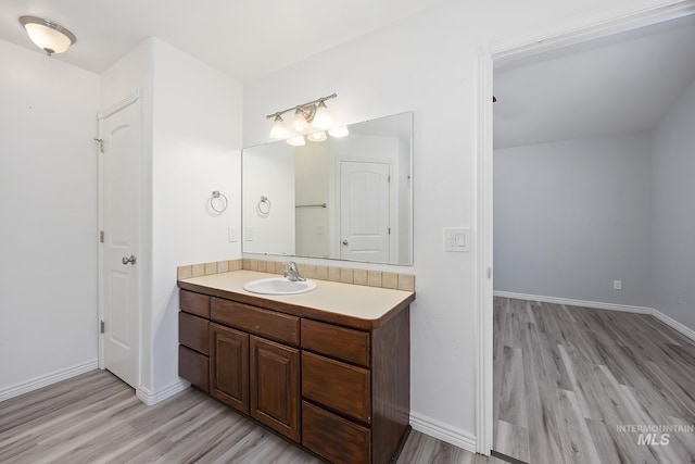 1030 Caswell Ave W, Twin Falls, ID 83301 - bathroom with wood finished floors and vanity