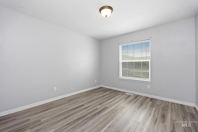 1030 Caswell Ave W, Twin Falls, ID 83301 - empty room with wood finished floors and baseboards