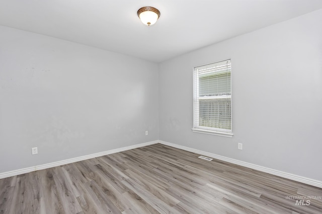 1030 Caswell Ave W, Twin Falls, ID 83301 - empty room featuring wood finished floors and baseboards