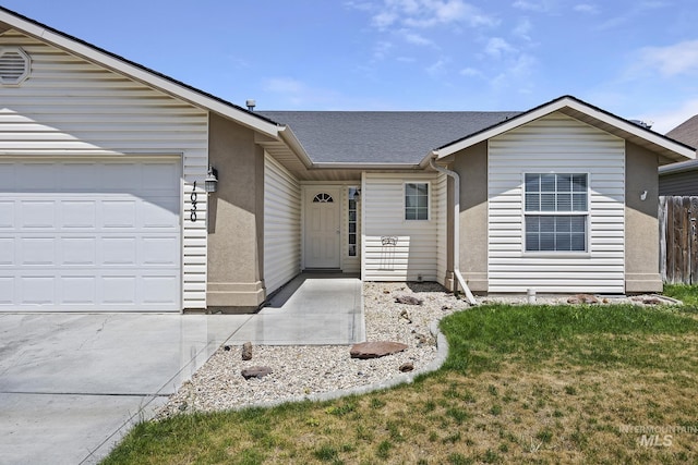 1030 Caswell Ave W, Twin Falls, ID 83301 - single story home with a shingled roof, a front yard, an attached garage, and concrete driveway