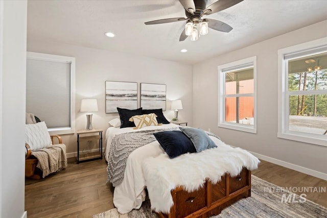 bedroom with wood finished floors, baseboards, recessed lighting, and ceiling fan