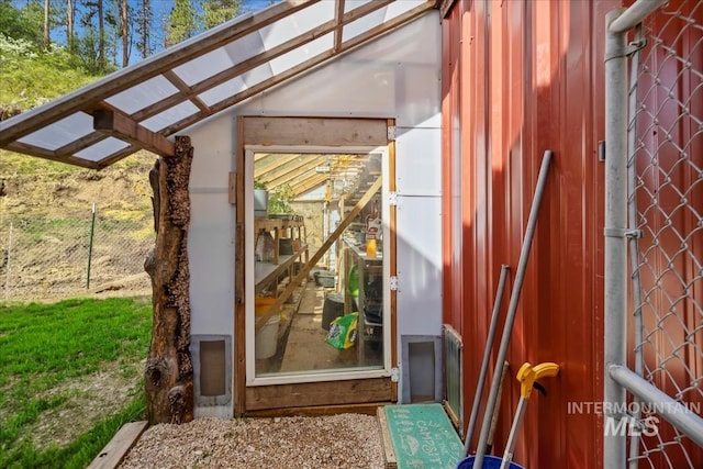 property entrance with fence