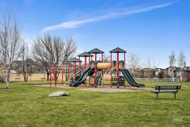 community jungle gym with a yard