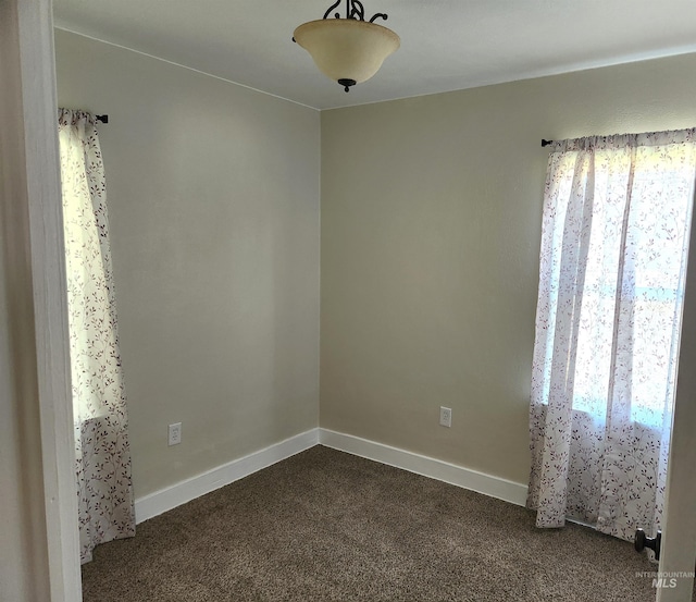 205 Nebraska, Gooding, ID 83330 - empty room featuring dark carpet and baseboards