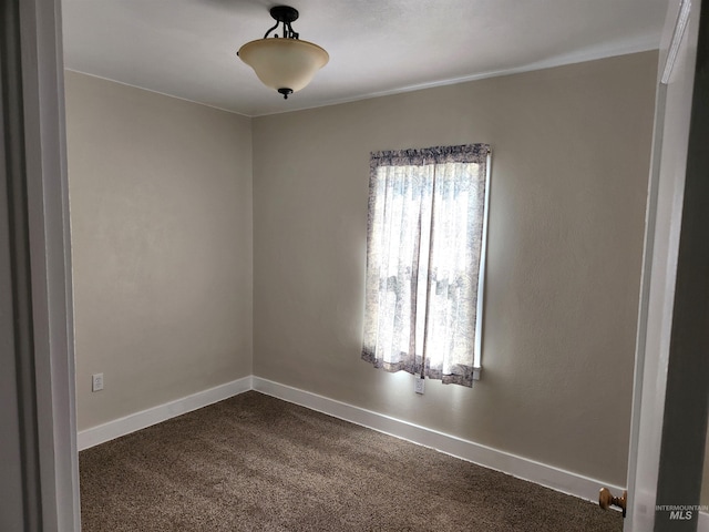 205 Nebraska, Gooding, ID 83330 - empty room with dark carpet and baseboards