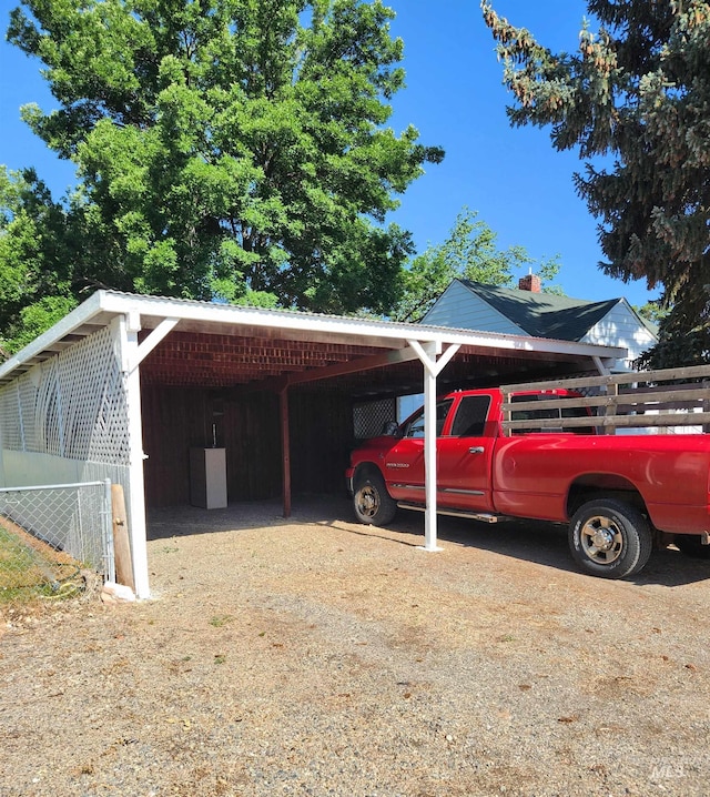 205 Nebraska, Gooding, ID 83330 - view of vehicle parking with a carport and dirt driveway