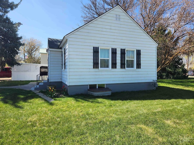 205 Nebraska, Gooding, ID 83330 - view of home's exterior featuring a lawn