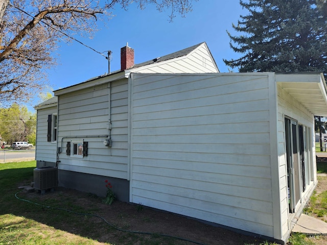 205 Nebraska, Gooding, ID 83330 - view of side of home with a chimney and a cooling unit