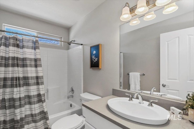 full bathroom featuring shower / bath combination with curtain, vanity, and toilet