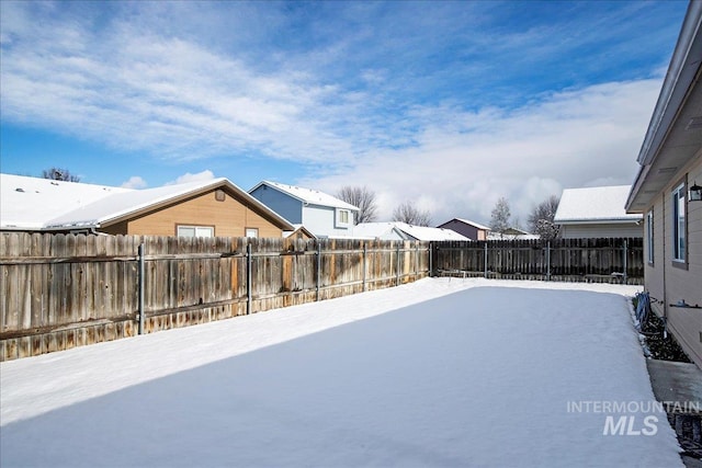 view of yard covered in snow