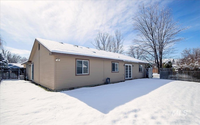 view of snow covered house