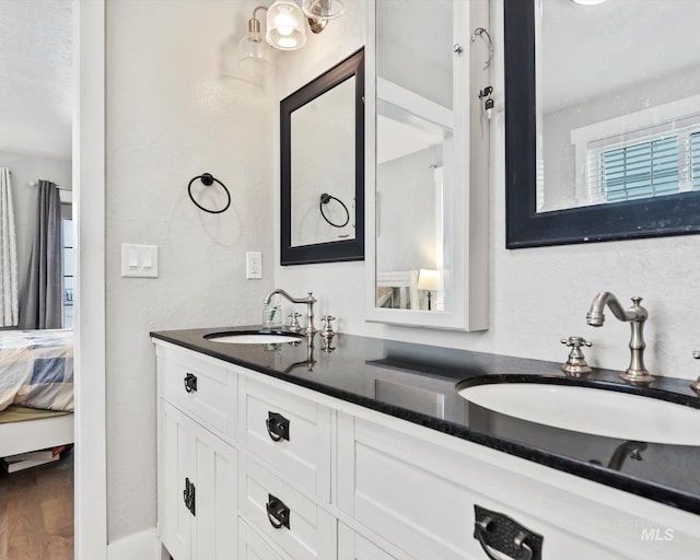 bathroom featuring vanity and wood-type flooring