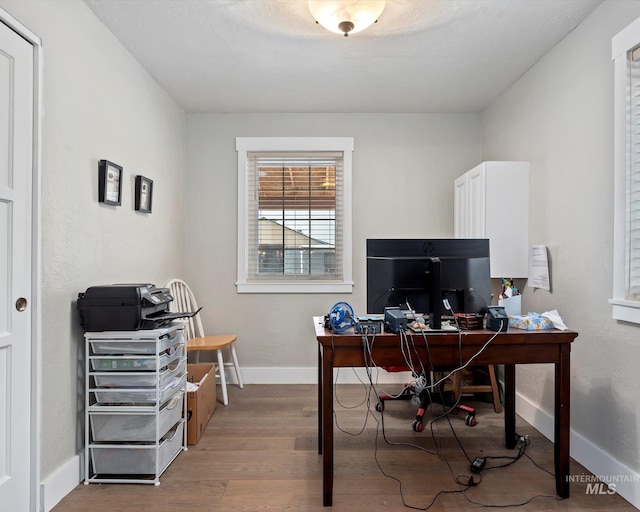 home office featuring hardwood / wood-style floors