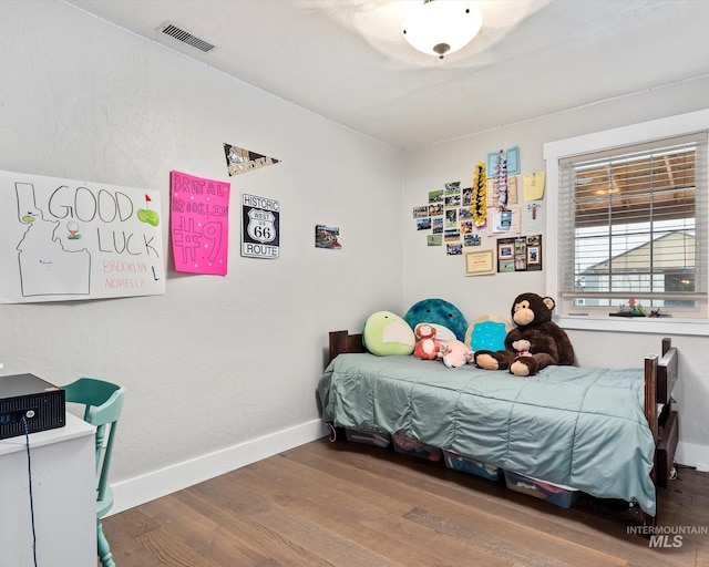 bedroom featuring wood-type flooring