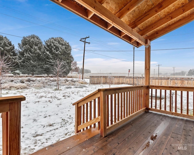 view of snow covered deck