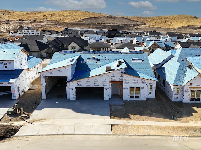 birds eye view of property with a mountain view