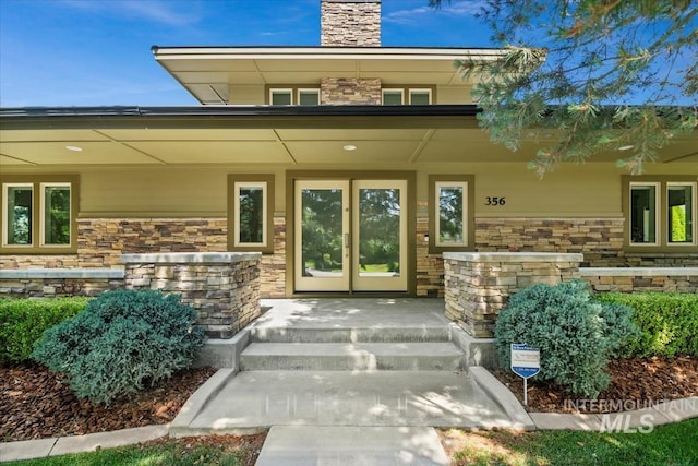 356 E Lake Briar Ln, Eagle, ID 83616 - property entrance featuring stone siding and a chimney