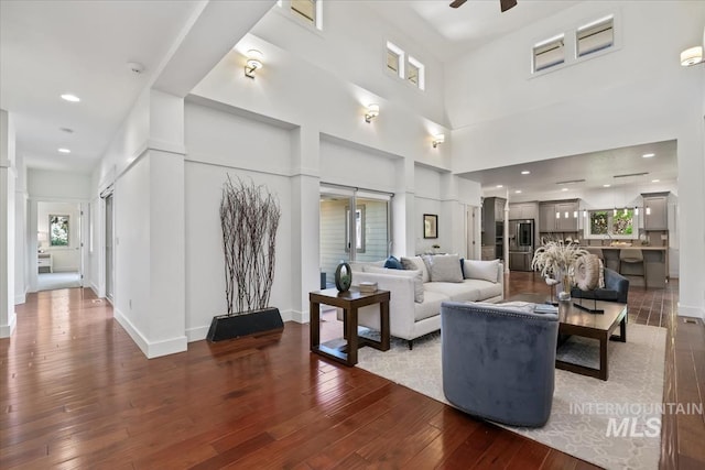 356 E Lake Briar Ln, Eagle, ID 83616 - living area featuring hardwood / wood-style floors, a ceiling fan, and a towering ceiling