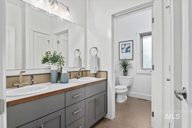 356 E Lake Briar Ln, Eagle, ID 83616 - bathroom featuring double vanity and baseboards