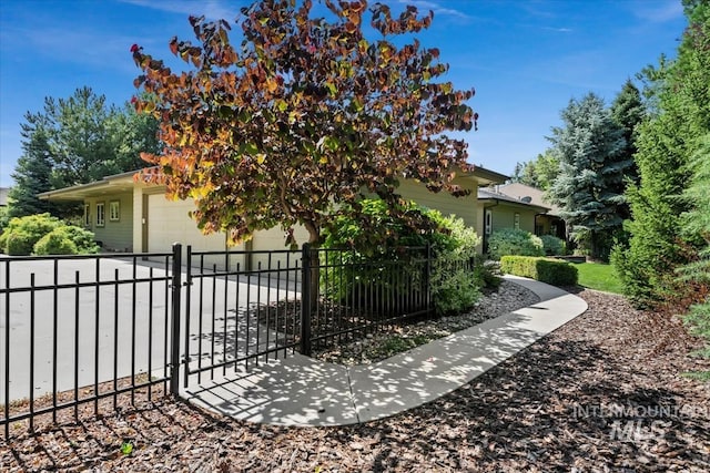 356 E Lake Briar Ln, Eagle, ID 83616 - view of side of home featuring a garage and a gate
