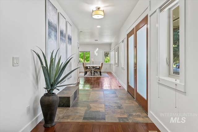 356 E Lake Briar Ln, Eagle, ID 83616 - hallway with baseboards and dark wood-style flooring
