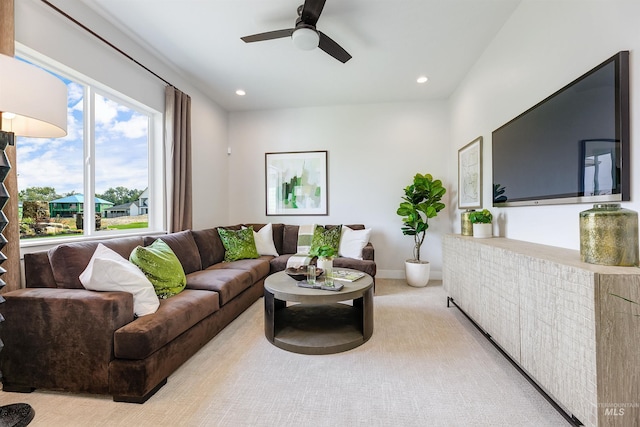 living room with ceiling fan, recessed lighting, and light colored carpet
