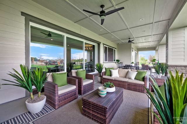 sunroom / solarium featuring a ceiling fan, an outdoor hangout area, and outdoor dining space
