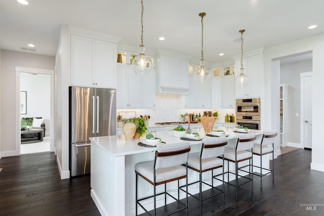kitchen featuring stainless steel appliances, recessed lighting, decorative backsplash, light countertops, and baseboards