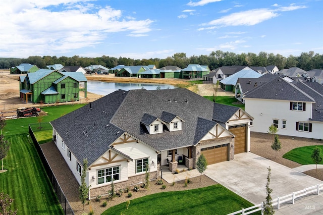 aerial perspective of suburban area with a large body of water