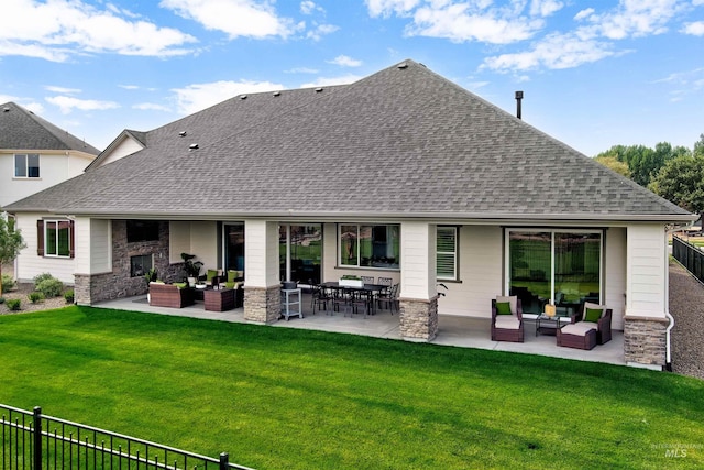 rear view of property featuring an outdoor hangout area, a shingled roof, a patio area, and stone siding