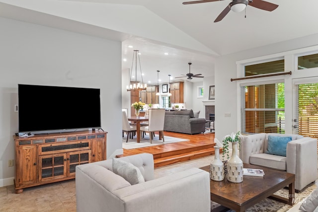 2411 S Marypost, Eagle, ID 83616 - living room featuring ceiling fan, lofted ceiling, a tile fireplace, and a chandelier