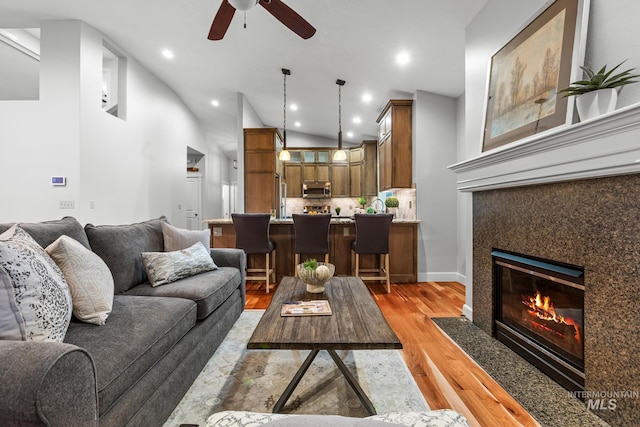 2411 S Marypost, Eagle, ID 83616 - living area featuring ceiling fan, light wood-type flooring, recessed lighting, a high end fireplace, and high vaulted ceiling